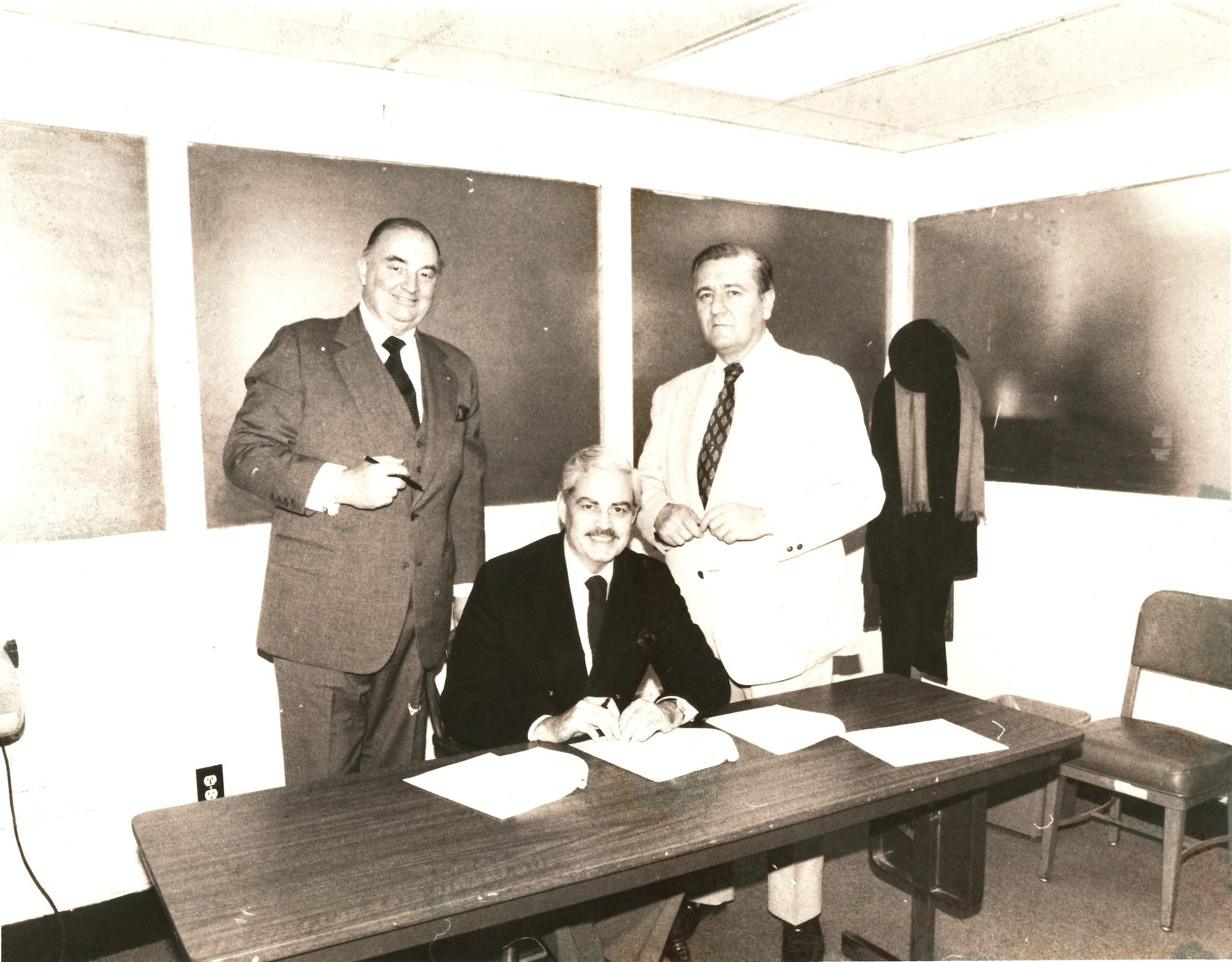 Historic photo of Marine Corps leaders signing official documents at the National Museum of the Marine Corps in Quantico, Virginia, honoring the legacy and history of Marine service